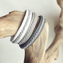 Load image into Gallery viewer, Traditional Lapland Sami reindeer leather bracelet with flat pewter. White, grey and blacks.