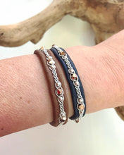 Load image into Gallery viewer, Scandinavian rreindeer leather bracelets with sterling silver beads and rose gold metallic Swarovski crystals. In nougat and navy.