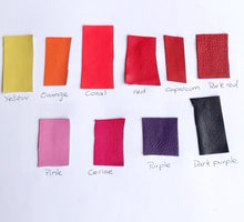 Load image into Gallery viewer, Traditional Sami reindeer leather bracelet with pewter in reds, pinks and yellow.