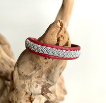 Load image into Gallery viewer, Traditional Sami reindeer leather bracelet with pewter in reds, pinks and yellow.
