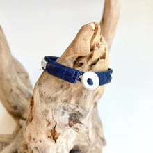 Load image into Gallery viewer, Traditional Sami reindeer leather bracelet with pewter in blues and greens.
