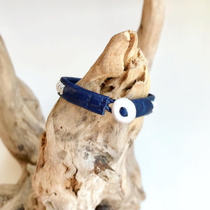 Traditional Sami reindeer leather bracelet with pewter in blues and greens.