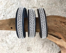 Load image into Gallery viewer, Traditional Swedish Sami reindeer leather bracelets with a braid of flat pewter threads and borders. Black, navy or charcoal - black shimmer.
