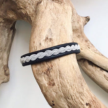 Load image into Gallery viewer, Sami black reindeer leather unisex bracelets, with a wavy pewter braid.
