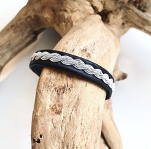 Load image into Gallery viewer, Sami black reindeer leather unisex bracelets, with a wavy pewter braid.
