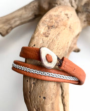 Load image into Gallery viewer, Traditional Sami reindeer leather bracelets, in tan with a braid of flat pewter threads.
