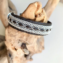 Load image into Gallery viewer, Traditional reindeer leather Sami bracelet, with pewter threads braids and pewter button.
