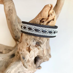 Traditional reindeer leather Sami bracelet, with wider pewter thread braids and pewter Celtic knot button.